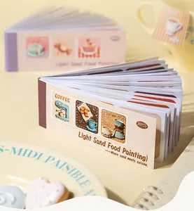 Close-up of 3D textured sticker book with Light Sand Food Painting designs for scrapbooking