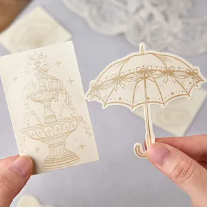 Autocollants vintage en papier nacré avec dessins au trait de fontaine et de parapluie