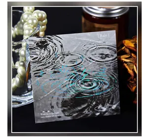 Detailed view of a rain-themed PET sticker with blue holographic ripples for journaling.
