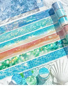Macro view of PET iridescent decorative tapes with ocean wave patterns on a sandy beach