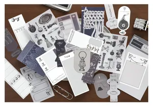 Detailed macro view of vintage manuscript style scrapbooking stickers and material papers.