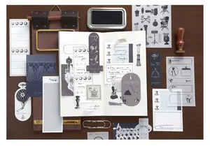 Detailed view of vintage journaling material kit with retro paper scraps and decorative stickers.