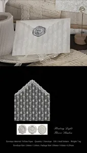 Detailed view of translucent lace vellum envelope set with vintage wax seals