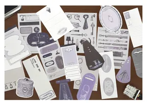 Retro scrapbook material pack with vintage illustrations and paper stickers on wood.