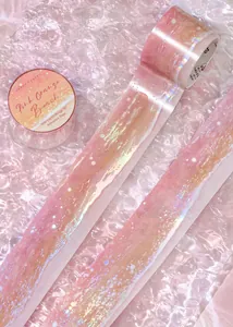 Close-up of holographic PET adhesive tape featuring a dreamy pink sea wave gradient design