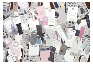 Detailed view of vintage scrapbooking material pack with various paper labels and stickers