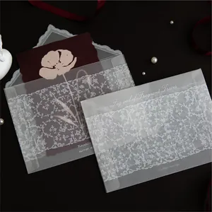 Elegant translucent tracing paper envelope set with delicate white lace pattern design