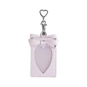 Cute pink RosyPosy bow card holder with heart-shaped window and polka dot pattern