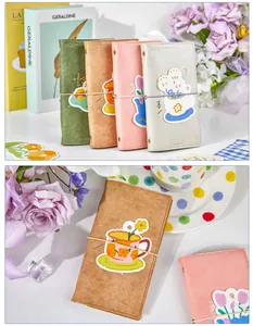 Detail view of A6 loose-leaf notebooks in various colors with cute cover illustrations