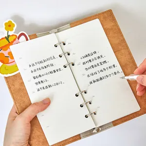 A6 minimalist brown loose-leaf notebook featuring weekly planner pages for students