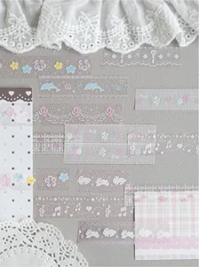 Close-up of decorative pixel art PET tape strips with flower and rabbit designs for scrapbooking