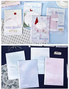 Detailed macro view of B5 cartoon theme notebooks in pastel pink and blue colors