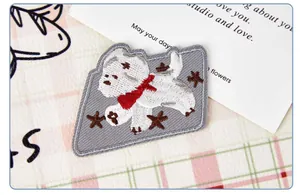 Close-up detail of cute cartoon dog embroidery patch for DIY clothing decoration