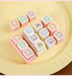 Close-up of detachable pastel square stamps with lifestyle icons for creative journaling