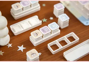 Detachable decorative stamps in a tray for journaling and DIY crafts