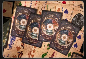 Close-up detail of vintage magic castle themed playing cards with intricate fantasy artwork