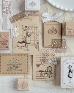 Macro shot of vintage wooden stamps featuring girl, cake, and carousel themed patterns.