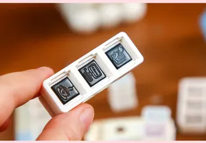 Macro detail of the triple stamp showing intricate leisure life icons for journaling