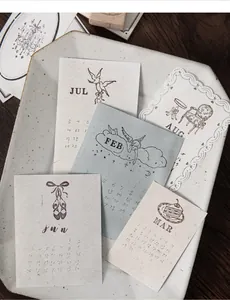 Macro detail of vintage fairy tale rubber stamp calendar patterns on textured paper