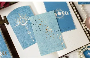 Close-up detail of specialty decorative scrapbook paper featuring intricate laser-cut star patterns
