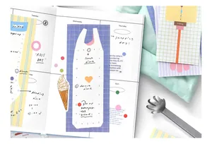 Close-up of cute Korean style bag-shaped sticky notes on a weekly planner page