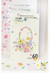 Detailed macro shot of floral scrapbooking stickers featuring a cute die-cut handbag design