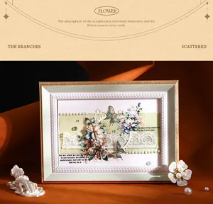Detail of decorative plant-themed scrapbook stickers in a vintage frame
