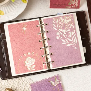 Elegant decorative scrapbooking paper with floral butterfly cutout designs for journal decor