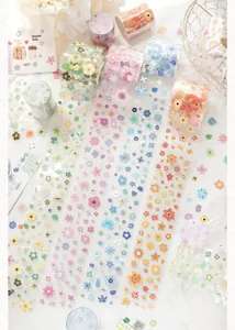 Close-up of vibrant floral die-cut washi tapes for DIY journal and scrapbook decoration