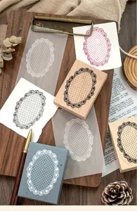 Detailed macro view of vintage lace border beech wood stamps for DIY scrapbooking