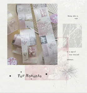 Macro detail of silver foil die-cut washi tape featuring vintage floral designs for journaling