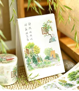 Macro detail of botanical die-cut washi tape and floral stickers for scrapbooking
