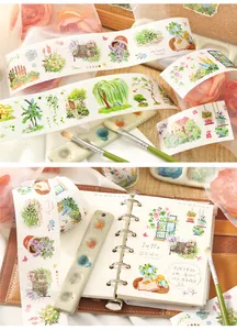 Detailed view of plant and flower themed washi tape stickers in a creative DIY journal