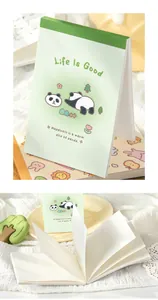 Close-up of cute panda mini notebook showing soft blank white pages for journaling