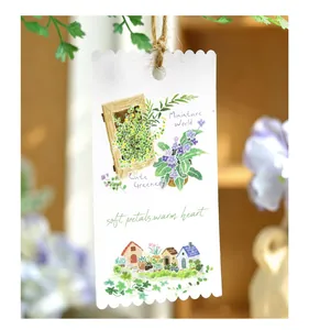 Detailed view of hand-drawn plant illustrations on a die-cut washi sticker tag