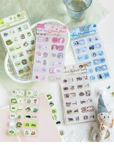 Detailed shot of pastel-colored cartoon index stickers for scrapbooking and journaling notes.