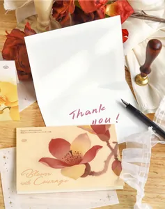 Detailed view of floral greeting cards featuring original illustrations and elegant calligraphy