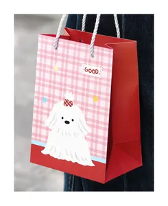 Vertical medium gift bag with cute white cartoon dog and red checkered pattern design