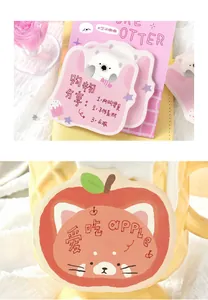 Detail of cute animal sticky notes featuring otter and cat apple illustrations