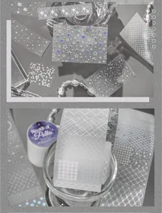 Minimalist glitter washi tape with star and grid patterns for DIY scrapbooking decoration.