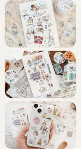 Detailed view of matte PET stickers on a smartphone and decorative paper sheets.