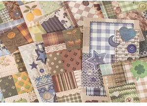 Detailed view of white kraft material paper with faux embroidery patchwork patterns.