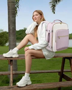 Outdoor lifestyle shot of a pink large capacity travel backpack worn by a model.