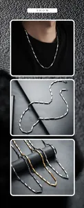Vue détaillée du collier en acier titane à maillons losanges en argent, or et noir