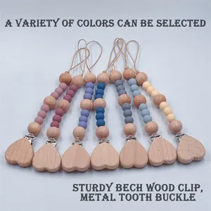 Pacifier clips with silicone beads and heart-shaped beech wood clips in various colors