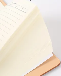 Close-up view of thick cream lined inner pages in a professional PU leather notebook.