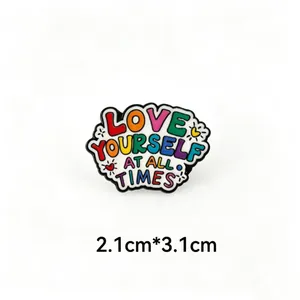 Detail view of colorful LOVE YOURSELF enamel pin showing dimensions of 2.1cm x 3.1cm