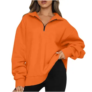 Vibrant orange half-zip pullover sweatshirt for women with loose fit and ribbed cuffs