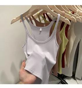 Close-up of a slim-fit ribbed knit tank top showing fabric texture and color options