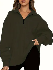 Detailed view of women's olive green half-zip oversized sweatshirt in soft fabric